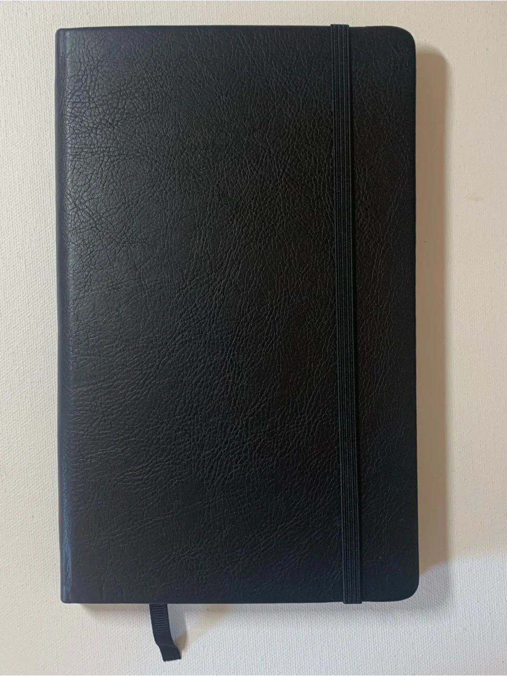 Black leather notebook with elastic band closure